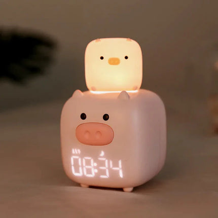 Vaaleanpunainen possu herätyskello lapsen huoneeseen