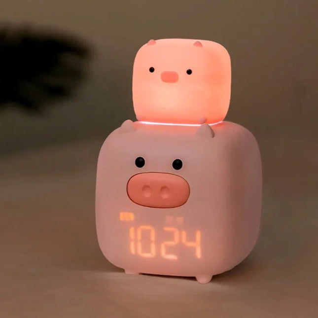Vaaleanpunainen possu herätyskello lapsen huoneeseen