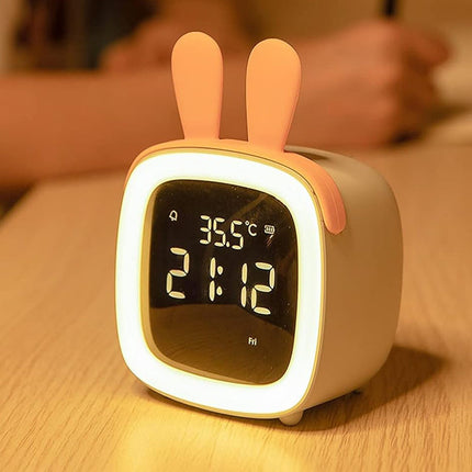 Söpö pupu herätyskello yövalolla lapselle