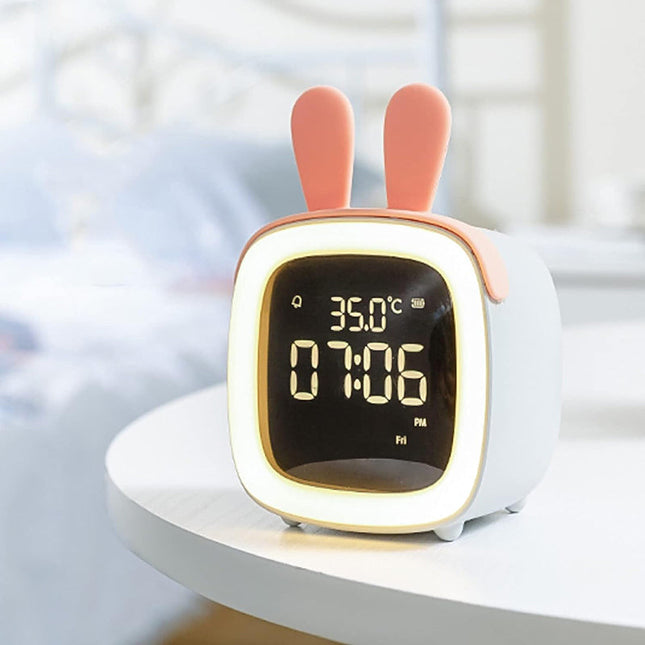 Söpö pupu herätyskello yövalolla lapselle