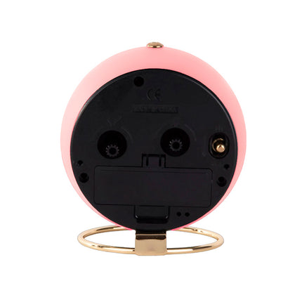 Vaaleanpunainen retro pöytäkello herätyksellä