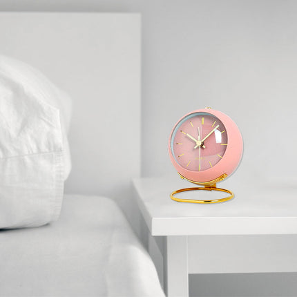 Vaaleanpunainen retro pöytäkello herätyksellä