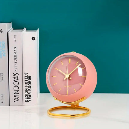 Vaaleanpunainen retro pöytäkello herätyksellä